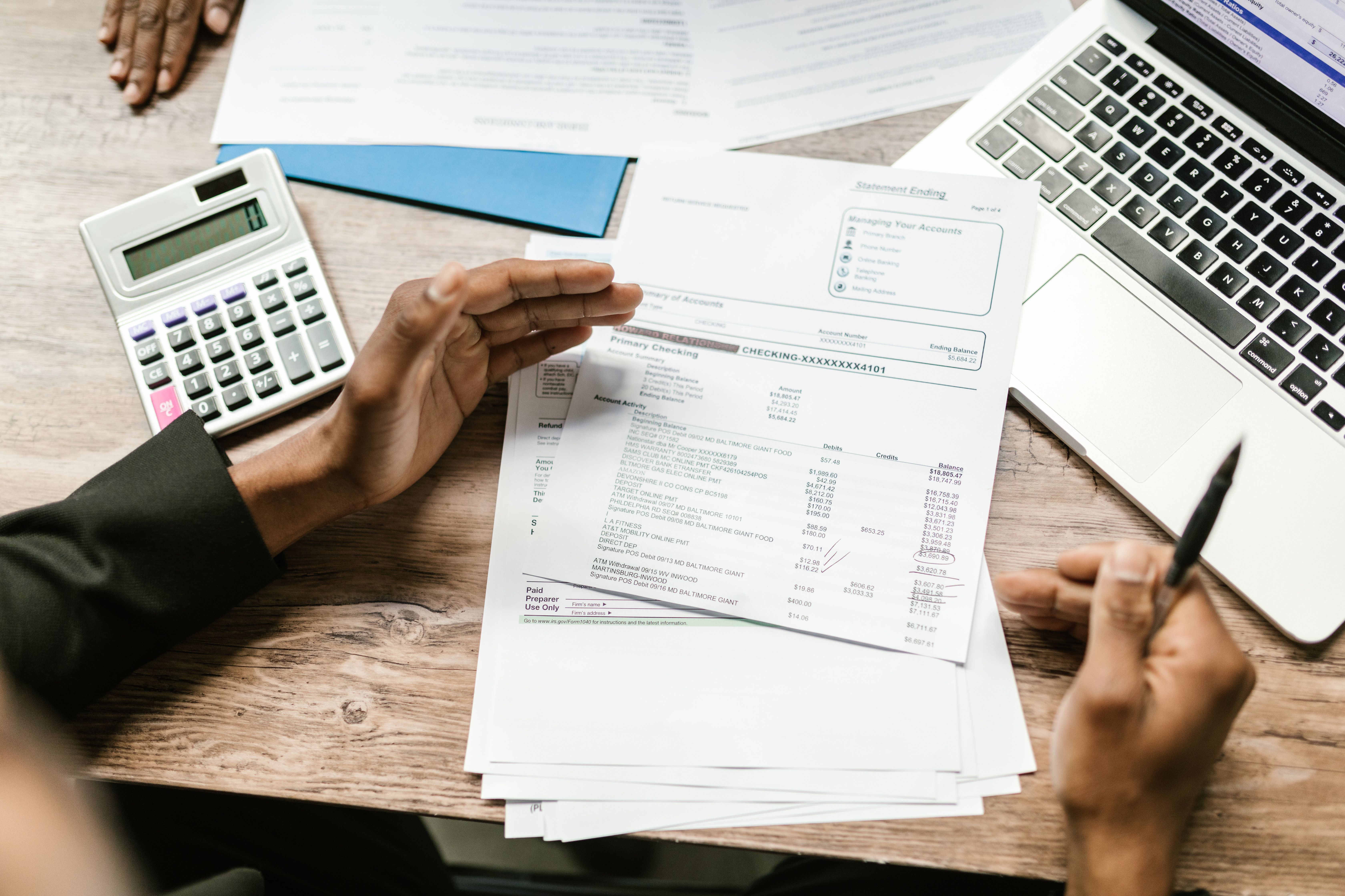 Reviewing financial statements and records at a desk